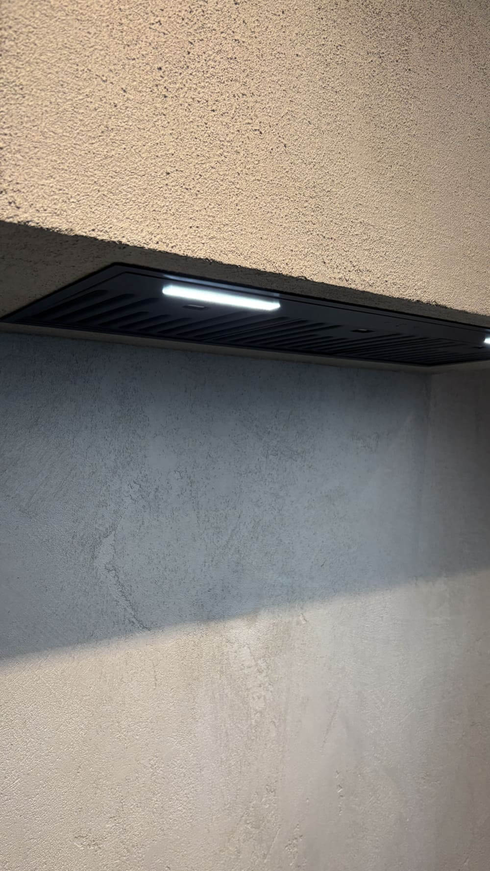 A slim frame that sits flush with the bottom edge of the cabinet